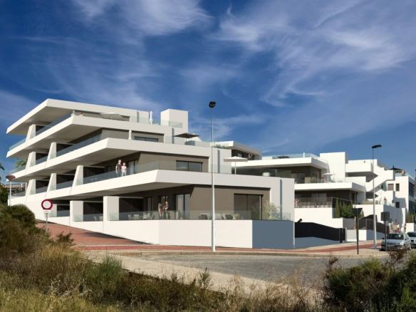 Moderne witte appartementen met ruime terrassen en uitzicht, gelegen in een rustige wijk.