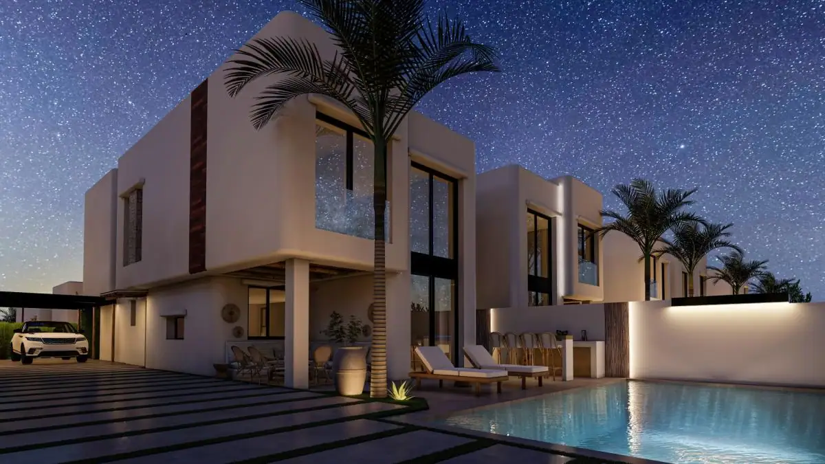 Moderne villa in Albir met privézwembad, terras en palmbomen onder een sterrenhemel.