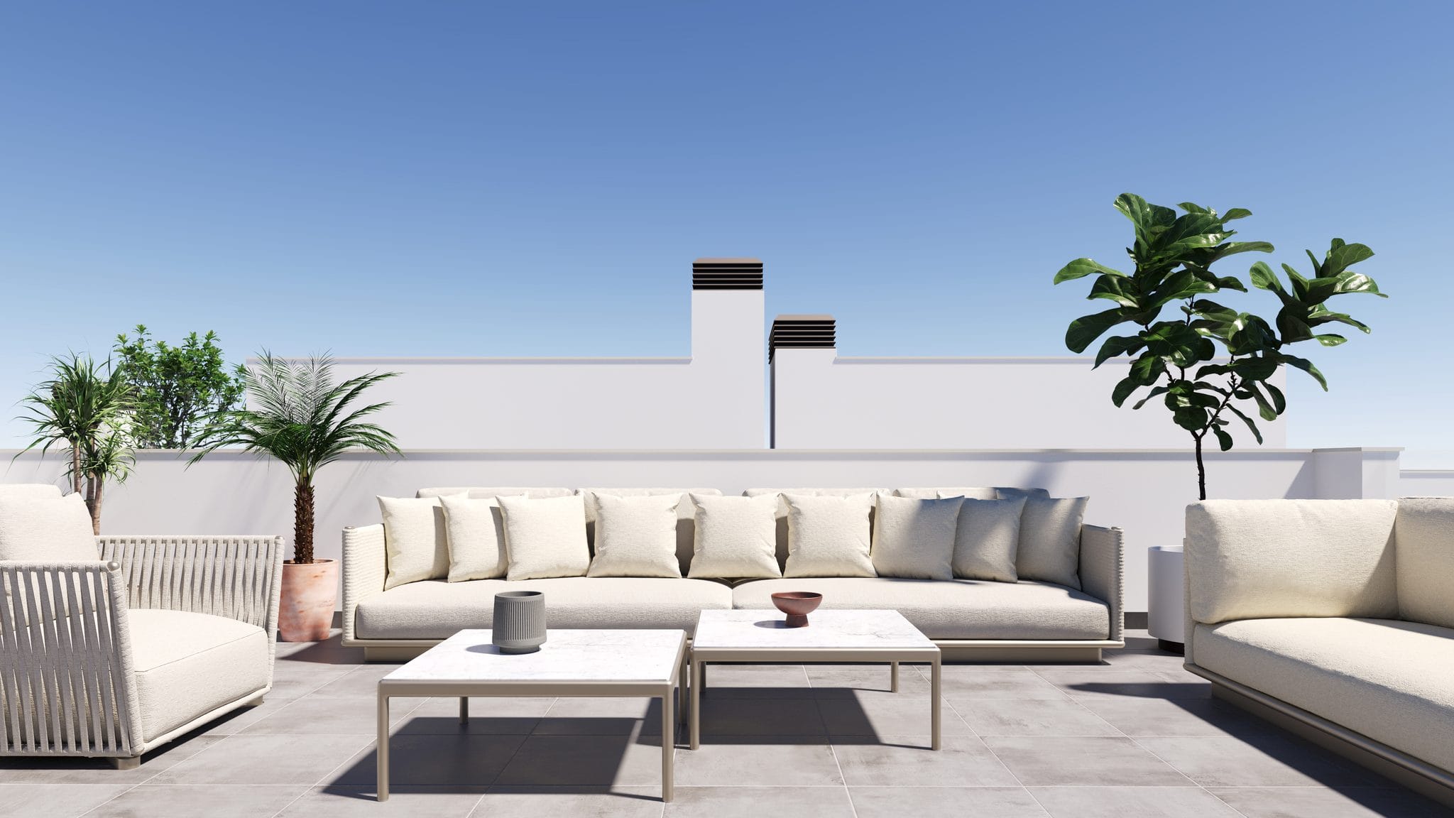 Ruime terras met comfortabele zitplaatsen en groene planten, ideaal voor ontspanning.