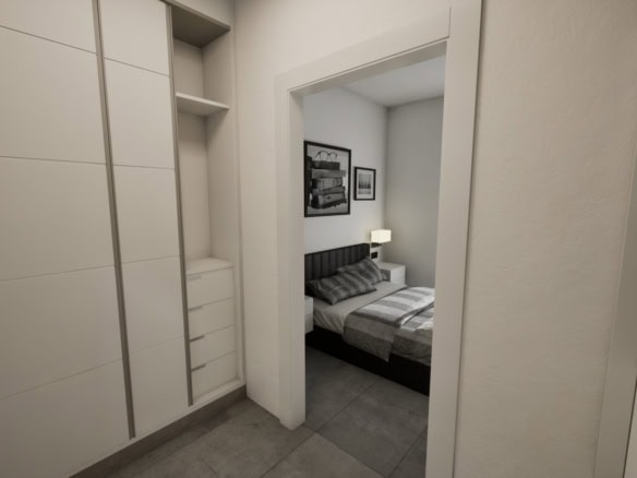 Ruime slaapkamer met inloopkast en moderne inrichting.