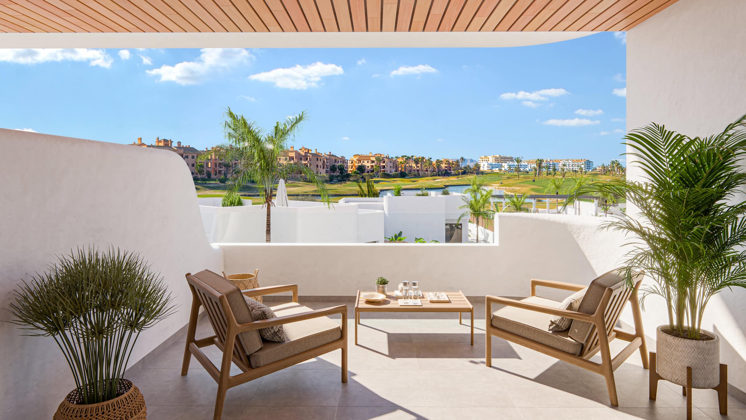 Luxe appartement met terras in Los Alcázares Ruime terras met zithoek en uitzicht op de tuin en de omgeving in Los Alcázares.